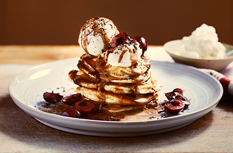 For an easy induglent treat, this pancake stack is hard to beat. Warm pancakes are piled high with ice cream, caramel mocha sauce and grated dark chocolate for the ultimate decadent dessert.