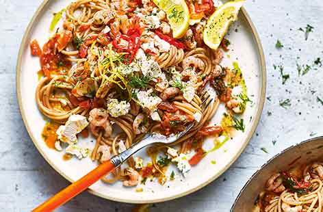 This quick pasta dish combines fresh flavours of prawns, lemon and vine tomatoes for a light midweek meal. Wholewheat spaghetti gives this meal a healthier touch for a dinner that comes together in 20 minutes.