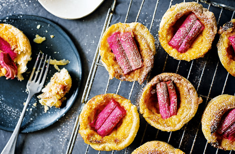 A seasonal spin on the classic teatime treat, gorgeously tart rhubarb is a heavenly match for creamy custard and flaky pastry in these moreish Portugese tarts