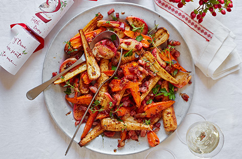 Sweet carrots and parsnips with apple, bacon, honey and thyme: what's not to love about this colourful Christmas side dish?