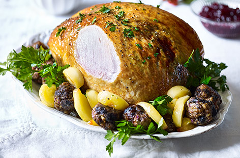 With a sweet apple and honey glaze and rich black pudding stuffing, this succulent roast turkey crown ensures a flavour-packed Christmas roast.