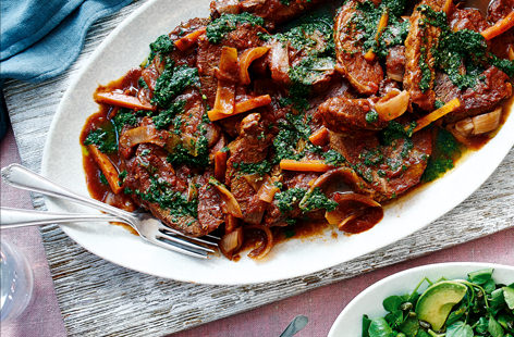 Serve up a tender slow-cooked brisket next time you are cooking for a crowd, drizzled with herby green salsa.