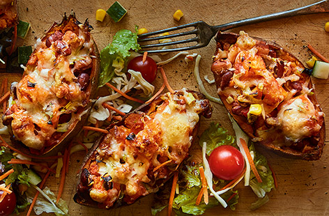 Dive in to these yummy and crispy sweet potato skins any time of the week. Filled with a mixture of creamy Manchego cheese, tender beans and sharp spring onions, it's a concoction that will tantilise your tastebuds!