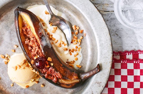 Melted buttery fudge and creamy milk chocolate filled bananas will impress guests at your next barbecue. This dessert is super easy to make, but no need to let anyone else know that.