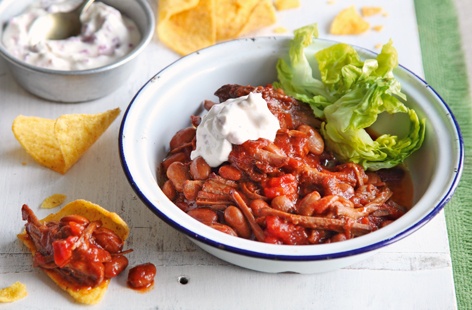 This seriously comforting summertime supper can be ready in under an hour. Tender pulled beef takes on the sticky sweetness of smoky barbecue sauce and hearty pinto beans add nutritious bite