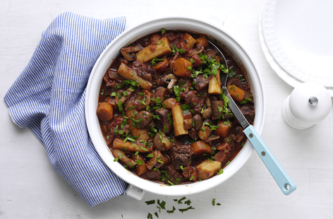 Steak that's slowly cooked until it's so tender, chunky root vegetables and a generous glug of red wine make this casserole the perfect weekend dinner. 