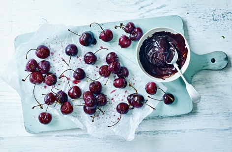 Nothing says summer like biting into a plump and juicy cherry. Roasting the fruit enhances its delicious natural sweetness and a velvety chocolate sauce instantly transforms it into a decadent dessert, perfect for rounding off an al fresco dinner party