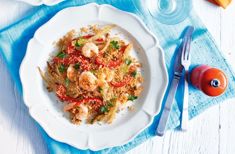 A light, summery dinner for two, fragrant prawns are tossed through paprika-spiced couscous and crunchy veggies, served with a silky garlic sauce