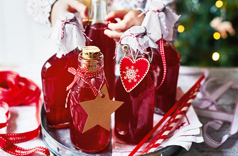 Tart cranberries, zingy lemons and caster sugar combine in this delicious cordial, a wonderfully festive edible gift idea that even the little ones can get involved with