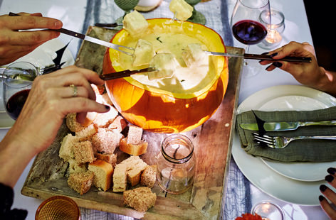 Tear up crusty pieces of bread and load onto forks before dipping into this rich and creamy fondue and scooping up a generous helping of the gooey, cheesy delight. A perfect dish for sharing that's so much fun.
