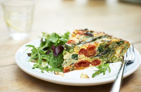 Frittatas are the ultimate one-pan supper and a great way of using up leftover eggs and vegetables. This summery version is extra chunky and crammed with masses of roasted new potatoes, asparagus and spinach