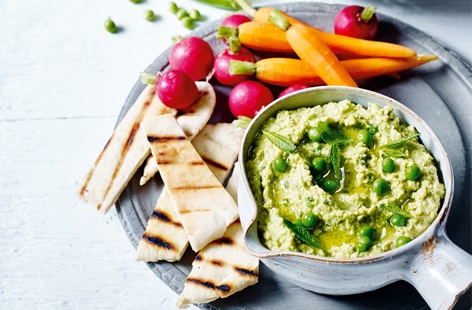 Fresh peas are at their best from July until October. We love de-podding bright, lucious peas and whizzing together with chickpeas, garlic, lemon and plenty of fresh mint, to make a wonderfully herby, sweet houmous