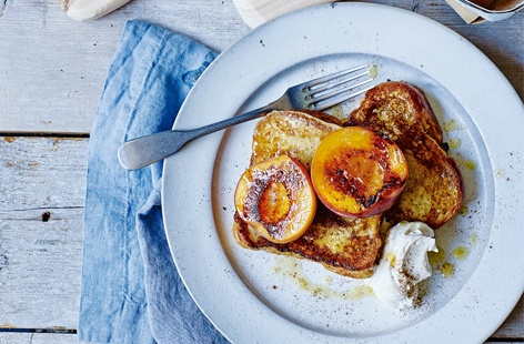 An indulgent, comforting way to enjoy the season's sweetest peaches – caramelised in brown sugar and butter and served on crisp, golden brioche infused with cinnamon, vanilla and orange. Finish off this easy summer dessert with a dollop of rum-spiked cream