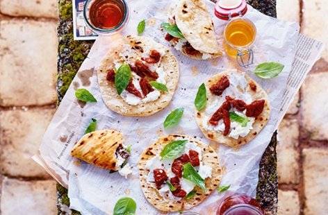 Dating back to Ancient Rome, these flaky breads are enjoyed traditionally with savoury cold fillings, such as juicy sun-dried tomatoes, creamy ricotta and fragrant basil. Making the dough is so simple and it is so satisfying to see the discs puff up.