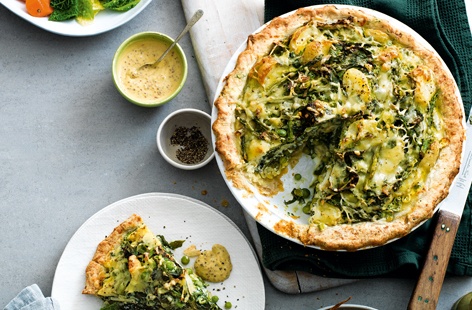There's more to Sunday lunch than meat and this alternative roast dinner shows just how satisfying vegetarian mains can be. We've given classic homity pie a seasonal twist, using fresh greens, peas, spring onions, asparagus and polenta