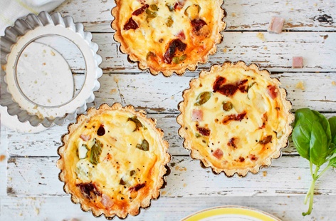 Kids will love these mini quiches, which are packed with honey-roast ham, juicy sundried tomatoes and fragrant basil
