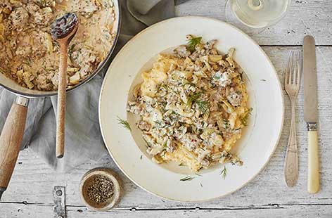 A delicious way to serve polenta, mixed with luscious crème fraiche and topped with a rich fennel, sausage and dill ragu. This simple dish makes a wonderfully warming supper that can be on the table in just 35 minutes