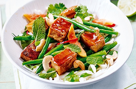 Give this inventive midweek meal a go – sticky tofu, cooked in a hoisin and honey glaze, with crisp green beans, rice noodles and juicy papaya. This delicious dinner for two can be ready in just 25 minutes