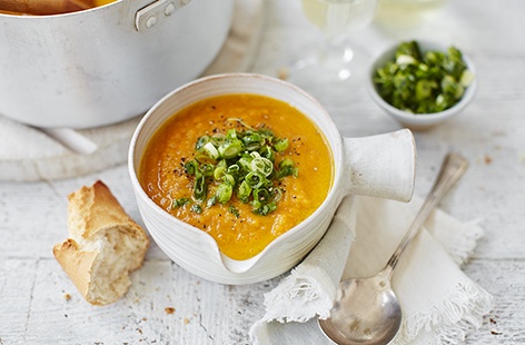 Rustle up this comforting soup made with fresh carrots, fragrant ginger and warming turmeric, topped with a spicy garnish