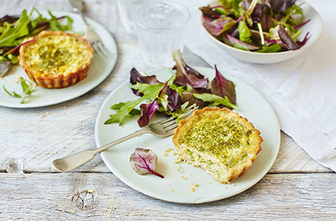 Perfect for picnics or lazy summer lunches, these delicious quiches combine the fresh taste of broad beans and mature Cheddar cheese with a subtle watercress and pine nut pesto