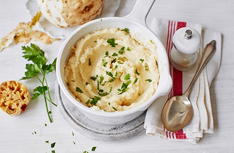 Nutty, slightly sweet celeriac blends lovingly with fragrant roasted garlic in this hearty, velvety purée. An alternative to your classic mashed potato side, this vegetarian dish is sure to impress at Christmas dinner.