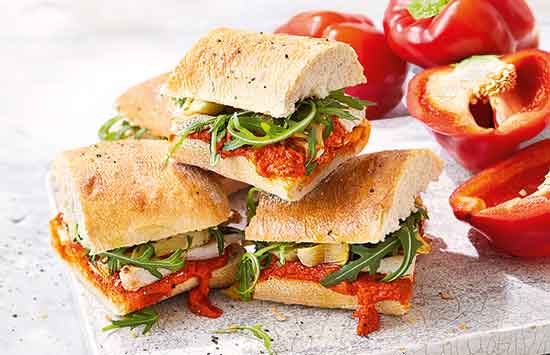 Try this colourful chicken sandwich for a simple summery lunch - crunchy ciabatta, tender artichokes and a punchy sauce made from roasted peppers, tomatoes and paprika fill every bite with flavour. 