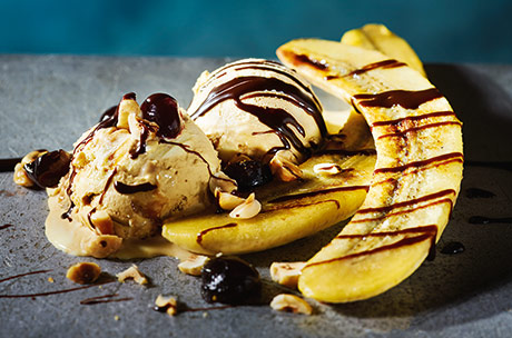 Hot chocolate sauce, buttery bananas, crunchy hazelnuts and smooth ice cream all combine in this ultimate banana split. The whole indulgent dessert comes together in just ten minutes - perfect for when you are craving a quick sweet treat.