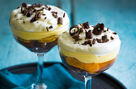 Chocolate Swiss roll drizzled with orange liqueur, topped with clementine segments, orange jelly, vanilla custard and fresh cream – this delightful Christmas dessert is a delicious way to finish your Christmas dinner