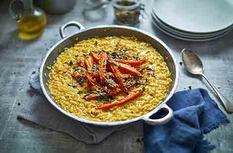 With its vibrant orange colour, this healthy vegan roasted carrot risotto recipe is sure to raise a smile