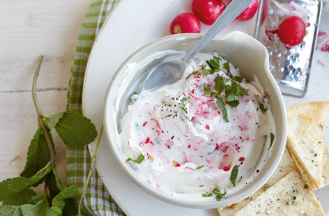 A nice twist on traditional tzatziki, using radishes instead of cucumber gives a peppery kick to this easy summertime dip. Make your own crispy flatbreads by drizzling quartered pitta breads with olive oil and bake until golden then dig in.