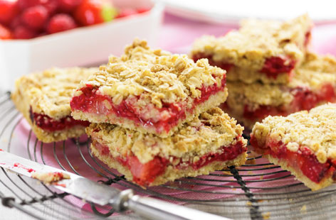 Raspberries and strawberries provide the perfect flavour combination, while baked oats provide the crunch in this sweet treat. Perfect with a cup of tea - just remember to give them ten minutes to cool down!