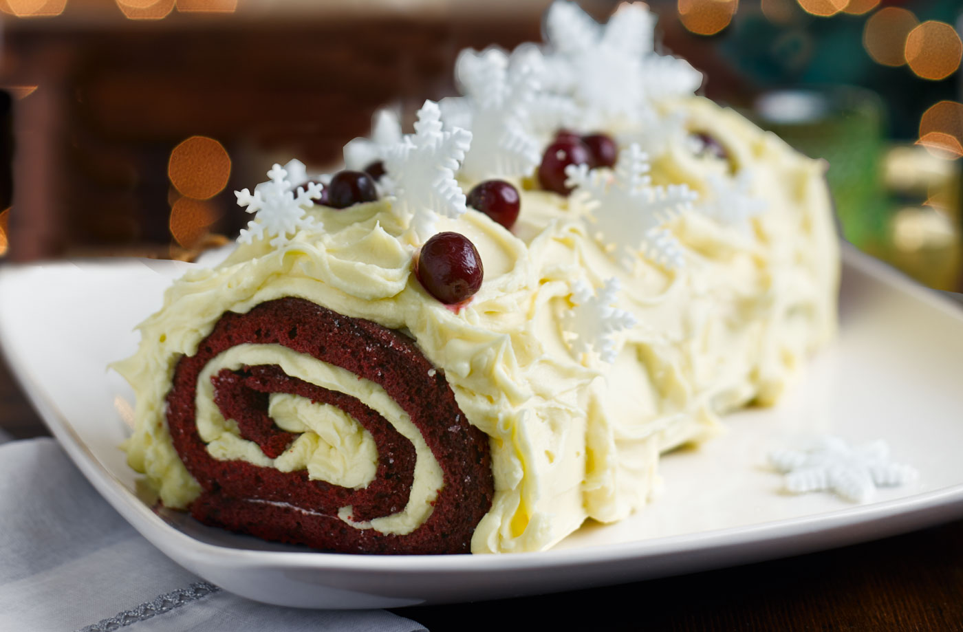 Red velvet bûche de Noël with boozy cranberries recipe