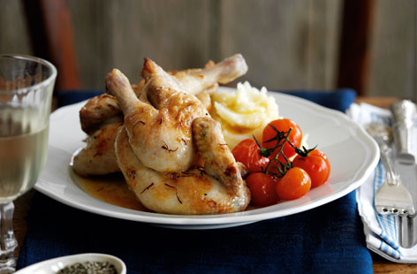 Mix up your traditional Sunday roast with this lovely roast poussin recipe. Cooking the meat with a pinch of saffron gives it a gorgeous hue, while roasting it with vine tomatoes and white wine results in a fabulous sauce. Serve with mash.
