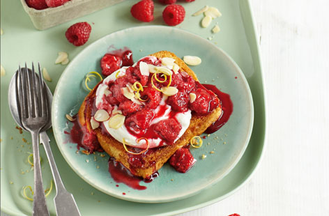 British raspberries are now at their summer best, so enjoy them with our tasty twist; roasted with ricotta on brioche. A sprinkling of icing sugar, lemon zest and flaked almonds gives this dish extra sweetness
