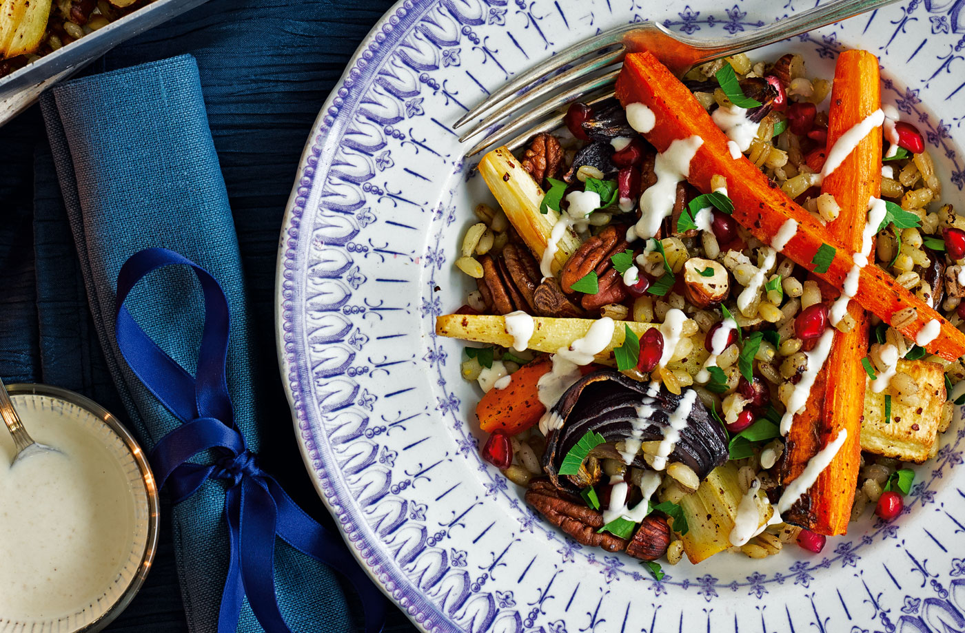 Root and nut traybake with pomegranate and yogurt dressing recipe