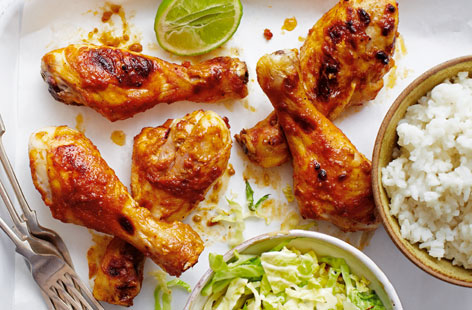 Give your chicken drumsticks a gorgeous nutty Asian twist. Satay sauce is mixed with sesame oil and lime juice for the peanut chicken. A big bowl of steaming rice and stir-fried, garlicky cabbage make the perfect side dishes.