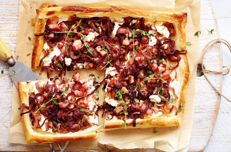 This tart is so simple but really looks the part. The slight saltiness of the ricotta works well with the sweetness of the red onions and smoky, saltiness of the bacon. Use ready rolled puff pastry to make it. Serve with a simple salad.