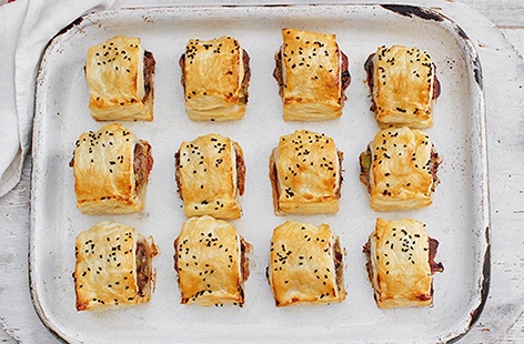 Upgrade your sausage roll recipe this season with the addition of softened leeks, zesty cranberry sauce and crunchy nigella seeds