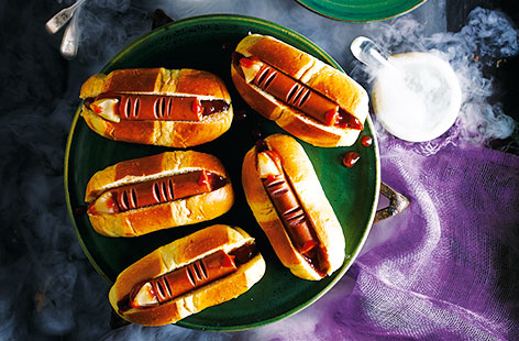 For a quick and easy Halloween snack, rustle up these simple spooky fingers made with tasty hot dog sausages and sweet brioche rolls. The ideal Halloween party idea - a bit of clever crafting and this classic meal is transformed into a scarily good dish