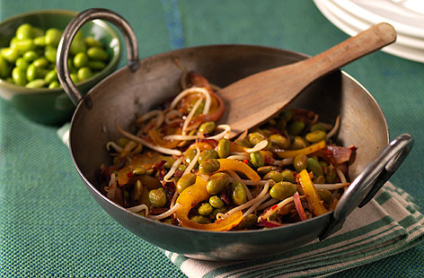This simple stir-fry works equally well as a veggie main or colourful side dish as part of a Chinese feast. Soya beans, pepper and beansprouts are cooked in a spiced garlic and ginger sauce for a fast 20 minute dish.