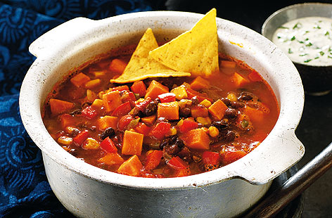 All the familiar flavours of a chilli con carne without the meat, this spicy bean and sweet potato stew is a straightforward and filling crowd-pleaser with black eyed beans, kidney beans, and sweetcorn. Simply leave out the crème fraiche finish for a vegan edition.