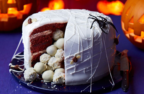 Halloween is the perfect time for pushing the boat out with your confectionary creations. This spider's nest cake might be spooky on the outside thanks to some nifty decoration but its delicious surprise cake ball interior is anything but.