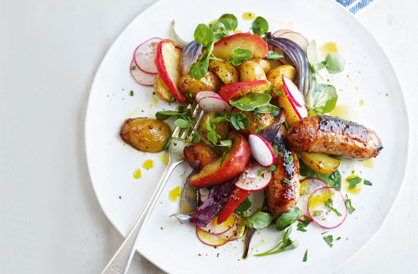 Sticky sausages, apples and potatoes with radish salad recipe