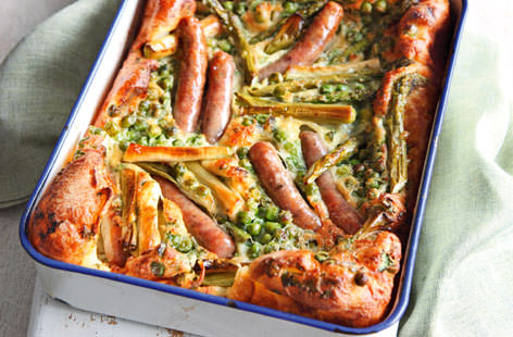 Toad-in-the-hole is a classic family supper, and we've made it suitable for summer by packing it with loads of seasonal veg
