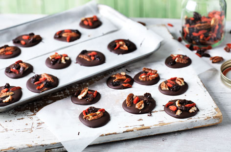 If you're looking for something other than After Eights to serve with coffee, these nutty chocolate nibbles are just like French mendiants and couldn't be more straightforward. Melted chocolate, dotted with raisins, dried berries and pecan chunks: pretty and classy.