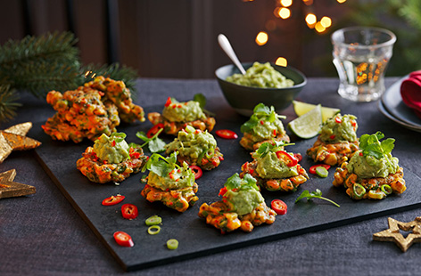 Channel your favourite Mexican flavours into this mini sweetcorn fritters recipe for a colourful canapé. The crispy golden fritters are loaded up with chilli, coriander and spring onions then topped with a dollop of smashed avocado for the perfect bite.