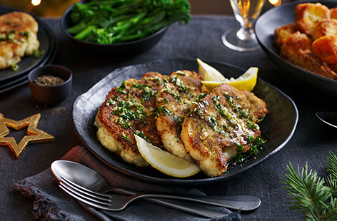 Need a vegan centrepiece for your Christmas dinner? Make this cauliflower Kiev schnitzel recipe for the perfect partners to your festive sides. Golden and crisp breadcrumbed cauliflower steaks are drizzled with herby garlic oil for a vegan twist on a retro classic.