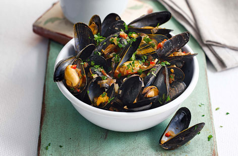 Meaty mussels are always delicious, but adding chilli and garlic really enhances their strong, salty flavour. Making your own skinny chips couldn't be easier, too. A brilliant dish to impress your dinner party guests with.