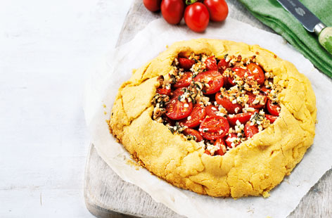 A rustic tomato tart, perfect for a weekend lunch. The pastry is made with flour and polenta whilst the filling is made with a layer of chopped blanched almonds and handfuls of juicy, halved Sugardrop tomatoes. Garlic, oregano and thyme enhance the sweet, fresh flavours of this satifying dish.