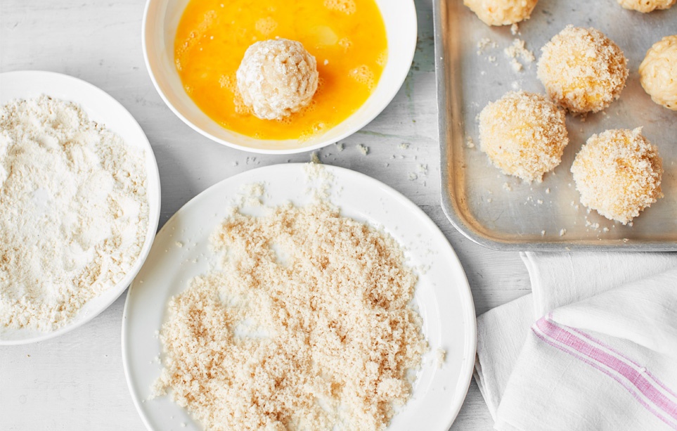 Coat the arancini
